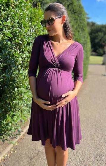 Maternity garment pattern showing front length extension and belly panel adjustments for pregnancy fit